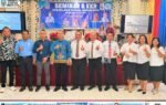 Foto bersama Seminar & KKR GPdI di Murung Raya, latar banner biru bertuliskan Program Mura Hebat, suasana panggung seminar dengan peserta rapi