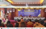 Ruang sosialisasi Pemkab Murung Raya menampilkan banner ungu tentang penyusunan profil kebutuhan pengembangan kompetensi ASN.