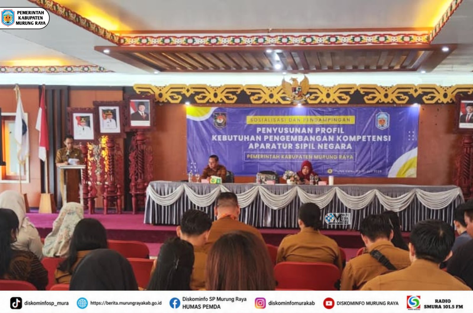 Ruang sosialisasi Pemkab Murung Raya menampilkan banner ungu tentang penyusunan profil kebutuhan pengembangan kompetensi ASN.